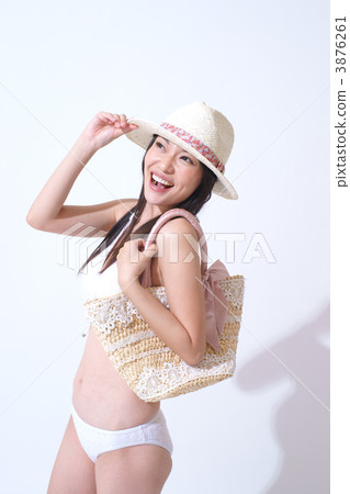 A young woman in a bathing suit 3876261