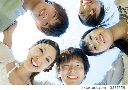 Young people forming a circle 3887359