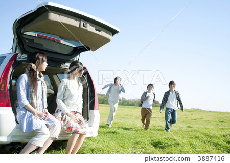 Two women sitting on the car carrier Two women sitting on the car carrier 3887416