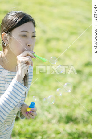 A woman with a soap bubble 3887547
