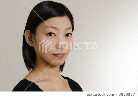 A woman in her twenties in black dress A woman in her twenties in black dress 3890887