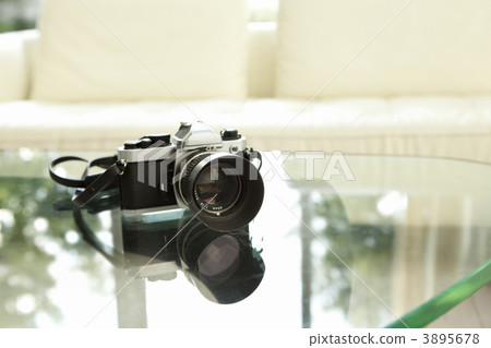 Camera on glass table Camera on glass table 3895678