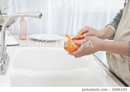 Hand girls peeling carrot 3896280