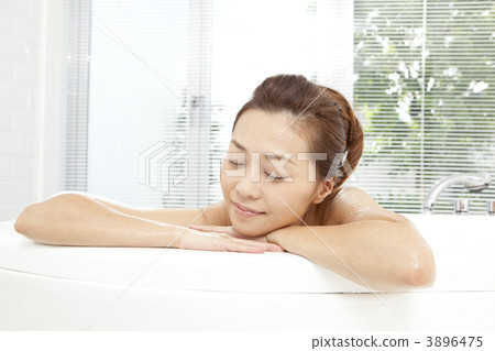 A woman taking a bath A woman taking a bath 3896475