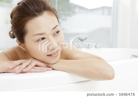 A woman taking a bath A woman taking a bath 3896478