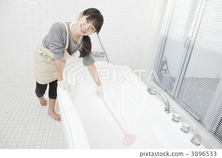 A girl cleaning a bath 3896533