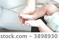 Mommy's hand, baby's foot 3898930