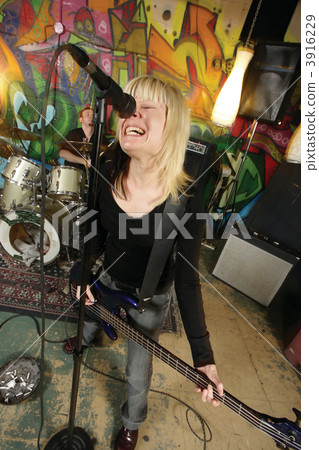 Female bass player screaming 3916229