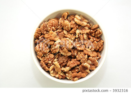 A bowl full of walnuts A bowl full of walnuts 3932316
