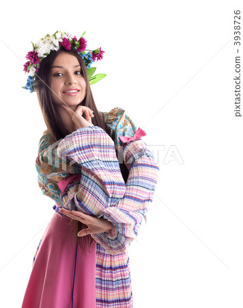 Beauty girl with garland posing in russian costume Beauty girl with garland posing in russian costume 3938726