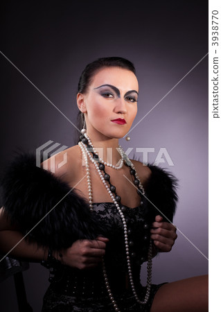woman in fur boa with pearl beads retro syle 3938770