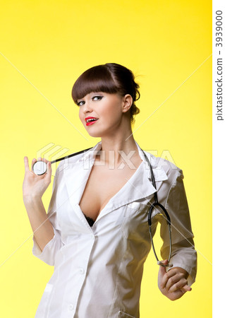 Sexual woman in nurse suit with stethoscope Sexual woman in nurse suit with stethoscope 3939000