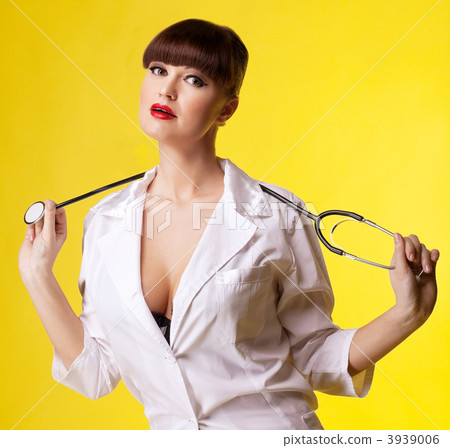 Sexual woman in nurse suit with stethoscope Sexual woman in nurse suit with stethoscope 3939006