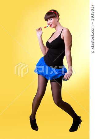 Beauty woman with lollipop smile you on yellow 3939017