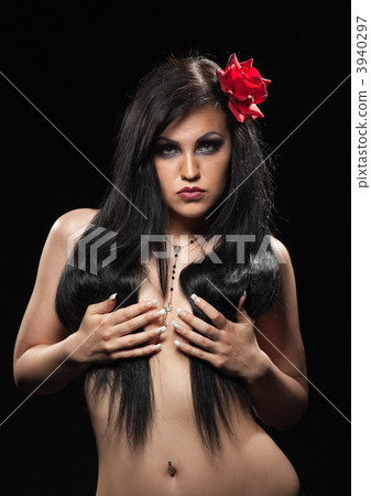 Woman with dark hair take breast in hands 3940297