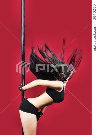 Woman in lingerie pole dance with black hair 3940299