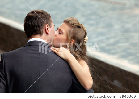 young wedding couple kissing 3940369