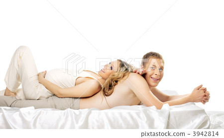 Happy pregnant wife lay on smile husband in bed 3942814