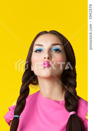 Beauty girl with funny make-up in doll costume 3942876