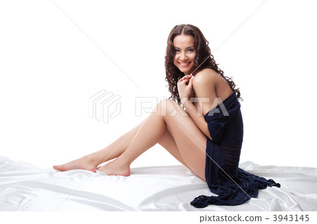 Young nude woman sit on white in knitted jacket 3943145