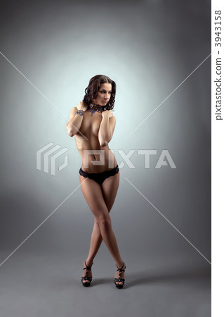 Young naked woman stand and close breast by hands Young naked woman stand and close breast by hands 3943158