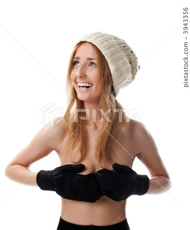 Happy blond woman close breast with mitten 3943356