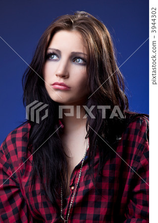 Young depressed girl in red shirt look with sad Young depressed girl in red shirt look with sad 3944302