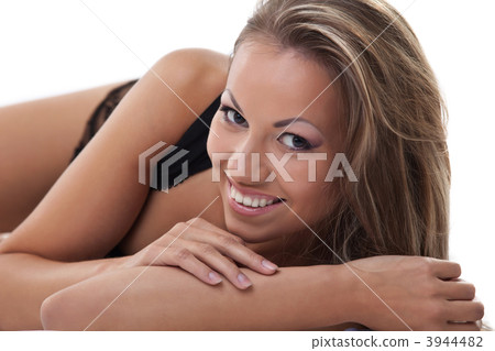 Sexy woman lay and smile at camera 3944482