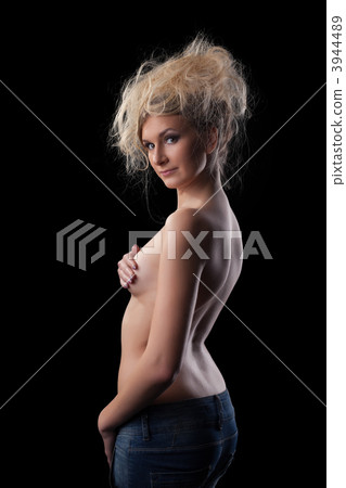 Young woman in jeans close breast 3944489