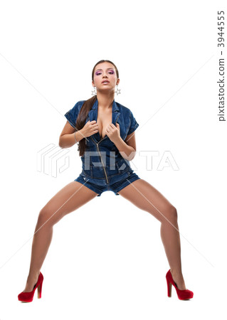 Sexy girl posing in jeans dress isolated Sexy girl posing in jeans dress isolated 3944555