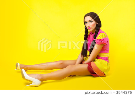 Funny girl in doll costume and make-up 3944576