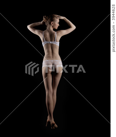 Sexy young woman stand in beauty white lingerie Sexy young woman stand in beauty white lingerie 3944628