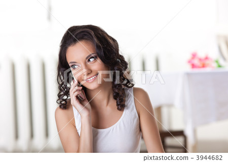 Cute woman in tank top call a phone Cute woman in tank top call a phone 3944682