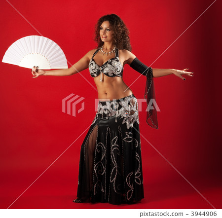 Woman belly dance with fan 3944906