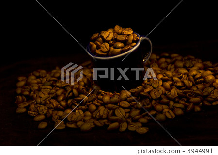 dark cup with coffee beans dark cup with coffee beans 3944991