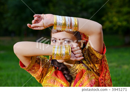A young Indian woman hiding face A young Indian woman hiding face 3945271