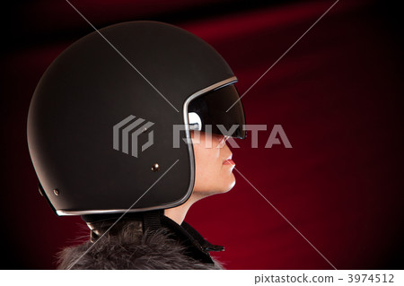 Biker girl in a helmet Biker girl in a helmet 3974512