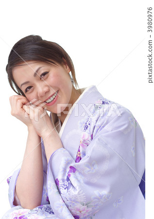 A kimono woman holding a cheek can A kimono woman holding a cheek can 3980976