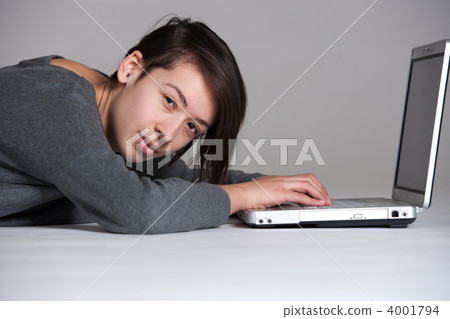 Young woman on floor with notebook 4001794