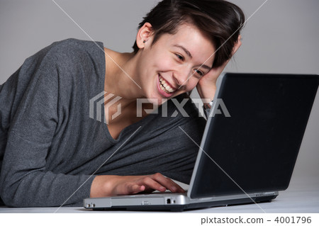 Young woman on floor with notebook 4001796