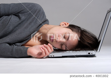Young woman on floor with notebook 4001802