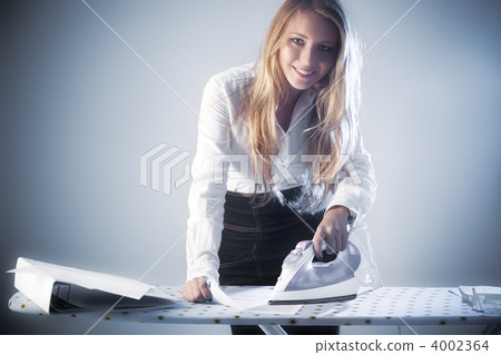 Young businesswoman iron paper documents 4002364