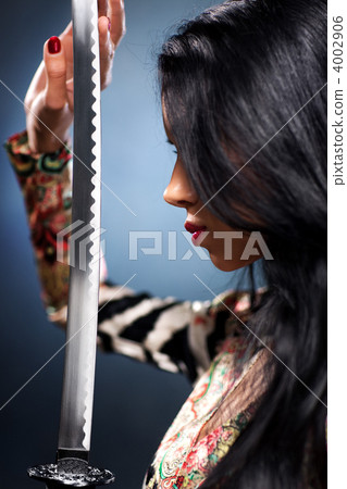 Young woman with samurai sword Young woman with samurai sword 4002906