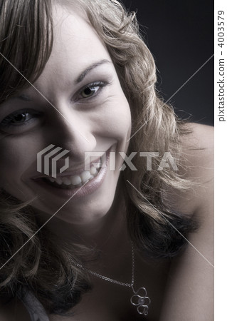 Teenager with a toothy smile Teenager with a toothy smile 4003579