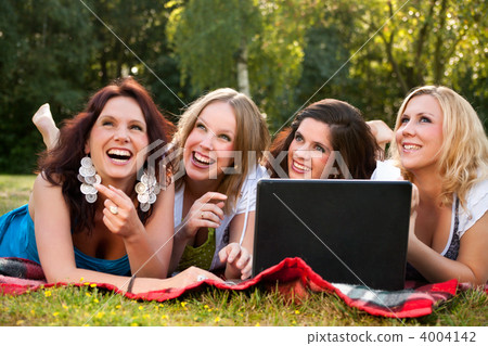 Happy women with a computer 4004142