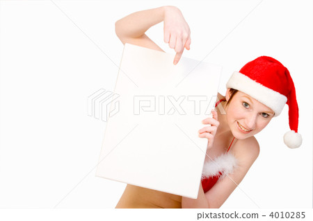 Christmas girl holding up a white sign for copyspace Christmas girl holding up a white sign for copyspace 4010285