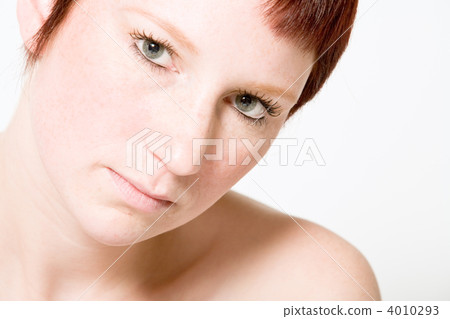Studio portrait of a questionable looking young woman with short 4010293