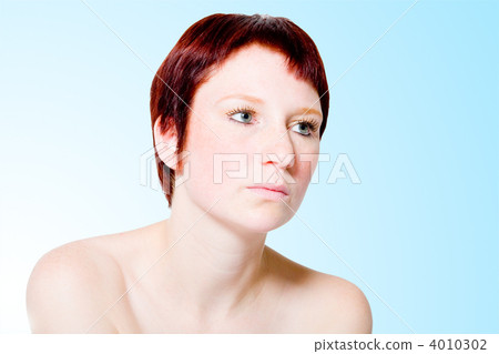 Studio portrait of an uninterested young woman with short hair Studio portrait of an uninterested young woman with short hair 4010302