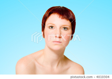 Studio portrait of a neutral looking young woman with short hair Studio portrait of a neutral looking young woman with short hair 4010304