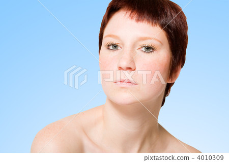 Studio portrait of an uptight young woman with short hair Studio portrait of an uptight young woman with short hair 4010309
